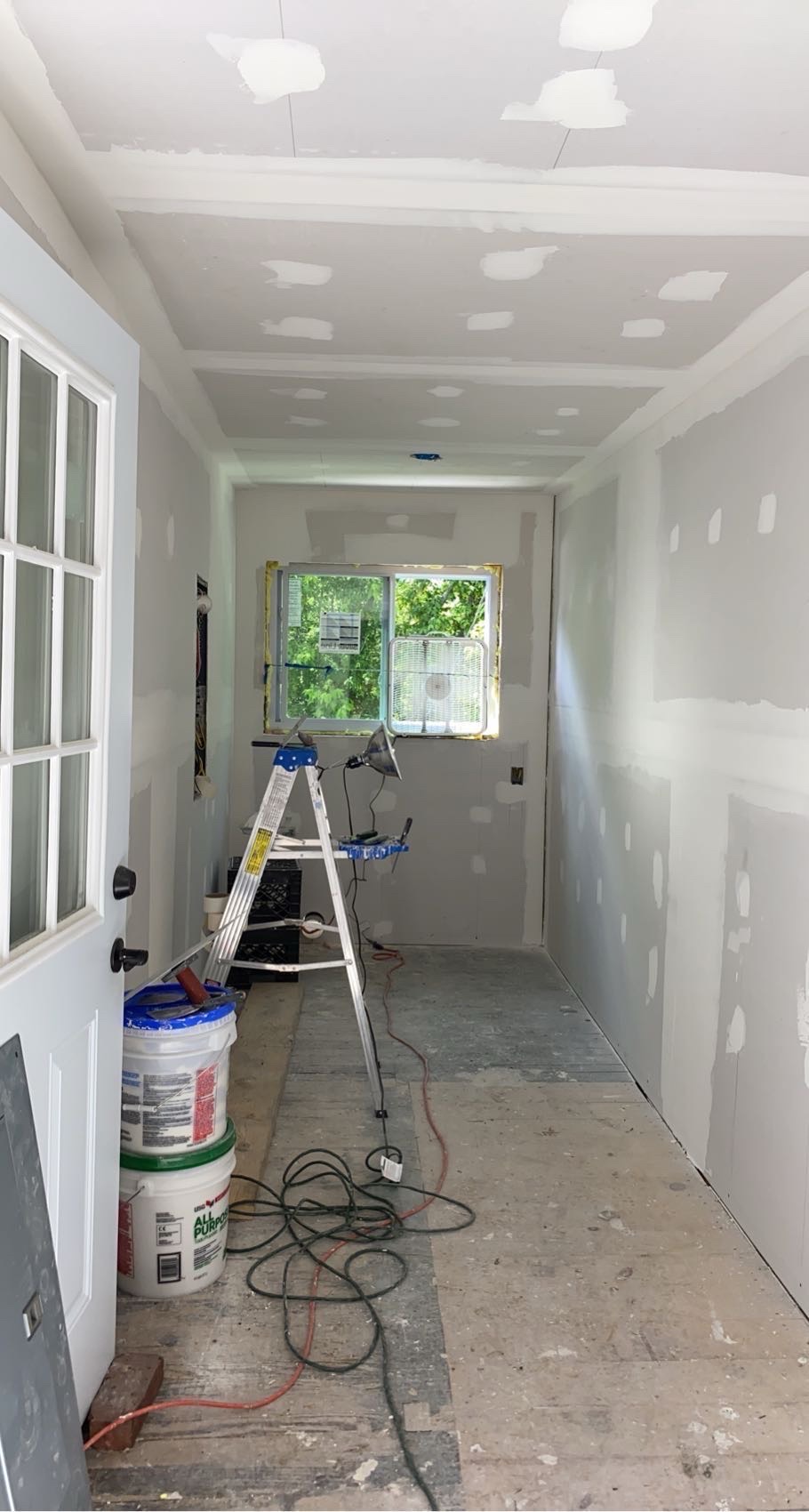 Drywall finishing during hallway renovation